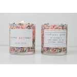 Two birthday candles in clear glass jars with colorful sprinkles