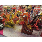 Gift bouquets made of candy bars and snack packs arranged in cellophane