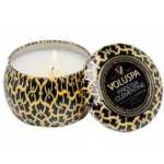 Patterned candle in a decorative tin with lid