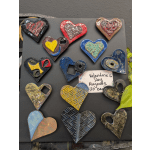 Heart-shaped ceramic magnets arranged on a display board
