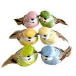 Six small decorative bird ornaments in pastel colors on a white background