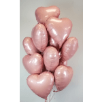 Cluster of pink heart-shaped balloons on strings