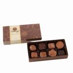Box of assorted chocolates with the lid open beside it