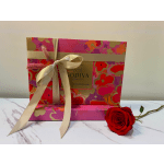 Gift box with a red rose and cream ribbon