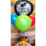Graduation balloon bouquet with colorful balloons and candy in a gift cup