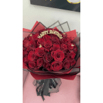 Bouquet of red roses with a gold "Happy Birthday" topper