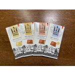Four MilkBoy Swiss chocolate bars on a wooden surface