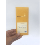 Hand holding a box of Moonstruck milk chocolate salted toffee