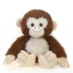 Brown and white plush monkey toy sitting upright