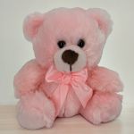 Pink teddy bear with a satin bow