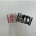 Glitter birthday cake toppers on wooden sticks in assorted colors