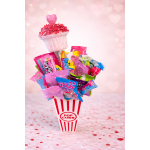 Candy bouquet in a popcorn container with a pink heart topper