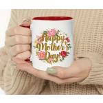 Person holding a white mug with a floral "Happy Mother's Day" design
