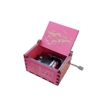 Pink wooden birthday music box with a crank handle