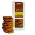 Box of milk chocolate pretzel twists with a stack of pretzels in front