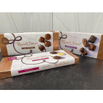 Three Russell Stover chocolate gift boxes on a table