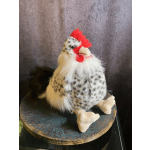 Decorative plush chicken figurine on a round patterned base