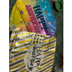Two colorful foil birthday balloons with "Happy Anniversary" and "Happy Anniversary" text