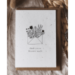 A thank-you card with a floral envelope illustration and text.