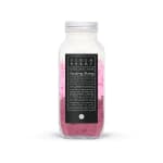 Bottle of pink fizzy salt soak with a black label