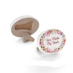 Two round decorative signs with floral borders and a smile message