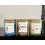 Three labeled soy wax candles in glass jars with bamboo lids