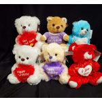 Assorted teddy bears with message hearts on a black background