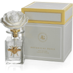 White porcelain flower-topped diffuser bottle with a gold bee and matching box