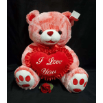 Pink teddy bear holding a red heart pillow with "I Love You" text