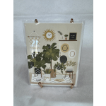 Decorative plant-themed art print in a clear holder