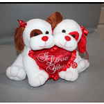 Two plush dogs holding a red heart that says "I Love You"