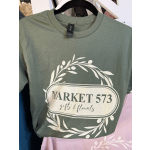 Olive green T-shirt with a floral wreath logo and Market 573 text
