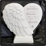 White angel wing heart plaque on a stand with memorial text