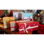 Assorted boxed chocolates and gift boxes with ribbon bows