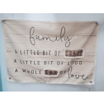 Fabric wall hanging with the words family, crazy, loud, lot, and love