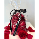 Gift bag of red rose petals with a red rose and black ribbon
