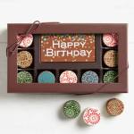 Box of decorated chocolates with a Happy Birthday card