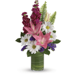 Pink lilies and white daisies in a green glass vase