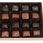 Box of assorted chocolate truffles in paper cups