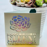 Birthday card with a holographic flower design and the words "Happy Birthday Ellen! We miss you!"