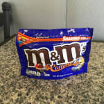 Bag of caramel M&M's candy on a countertop