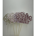 Glittery script cake toppers on wooden sticks with heart cutouts