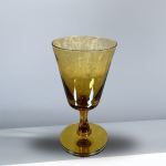 Amber glass goblet with a wide bowl and short stem
