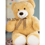 Large tan teddy bear with a polka-dot ribbon bow