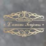 Decorative gold script logo on a dark background