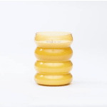 Yellow ribbed glass vase on a white background