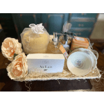 Gift basket with soap, lotion, tea, cups, and peach flowers