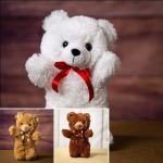 White teddy bear with a red ribbon, shown above two smaller teddy bears
