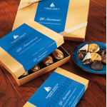 Boxes of assorted chocolates on a wooden table