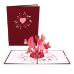 Pop-up Valentine card with pink hearts on a burgundy cover